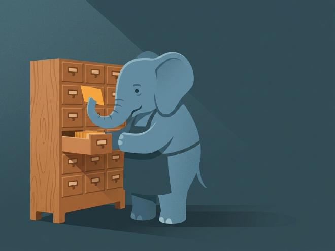 An elephant in an apron pulling an index card from a wooden card-catalogue drawer