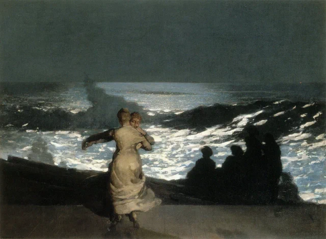 Two women dancing together on a shore at night while onlookers watch the moonlit surf