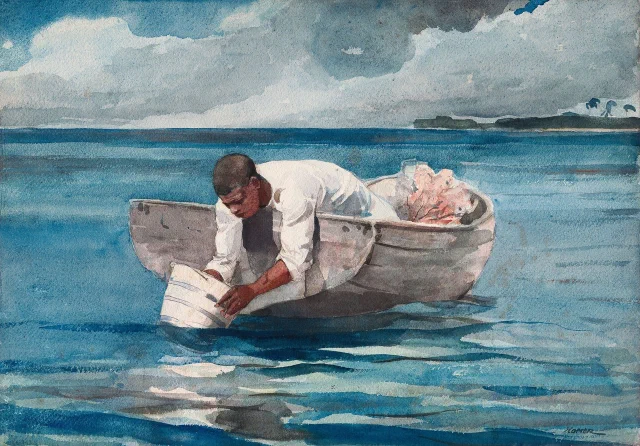 A man leaning out of a small boat over calm blue water, looking down through a glass-bottomed bucket